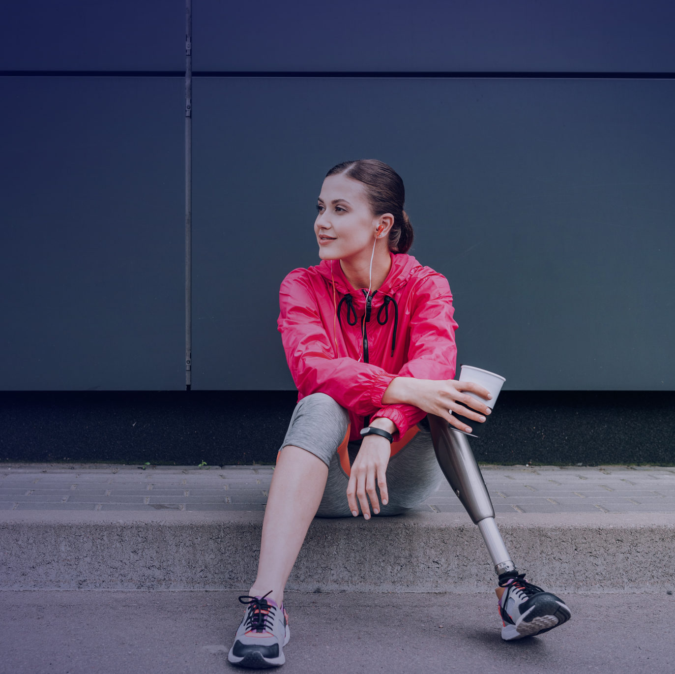 woman with prosthetic limb sitting down